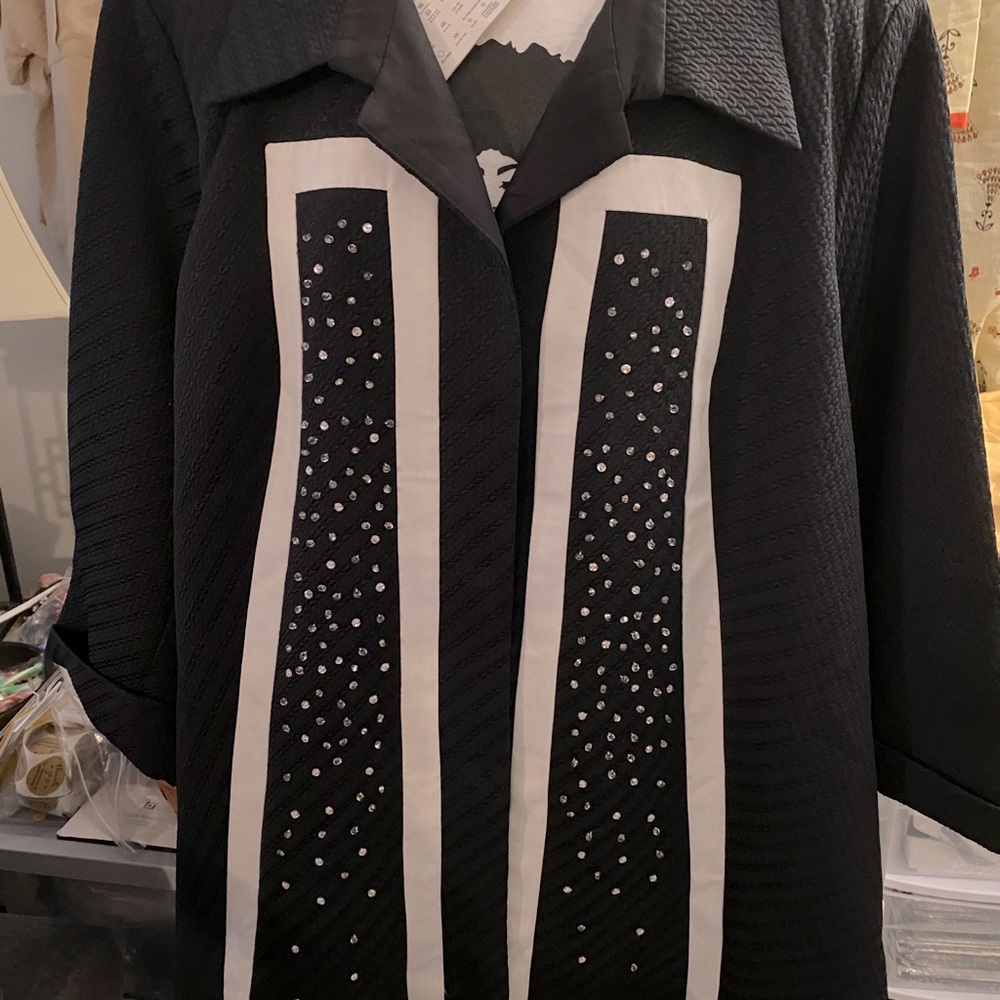 Black jacket with rhinestones.